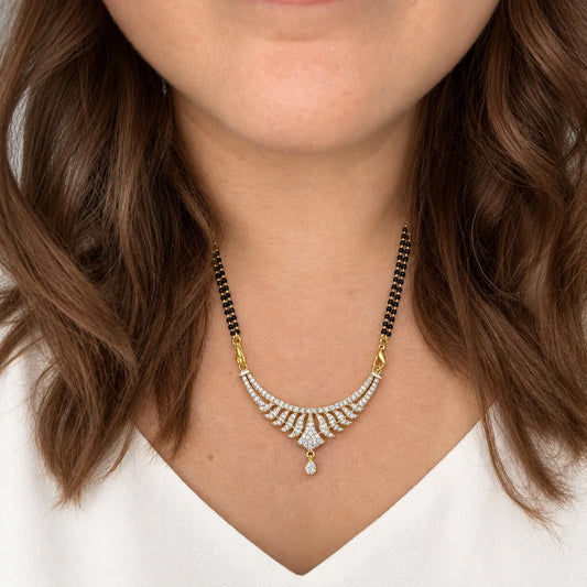 Aavira Grace Crystal Leaf Black Bead Mangalsutra by Oraki Jewels, shown worn in a natural studio crop