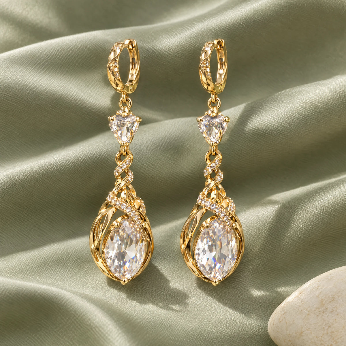 Heartelle Twist Teardrop Crystal Hoop Earrings by Oraki Jewels, styled studio view