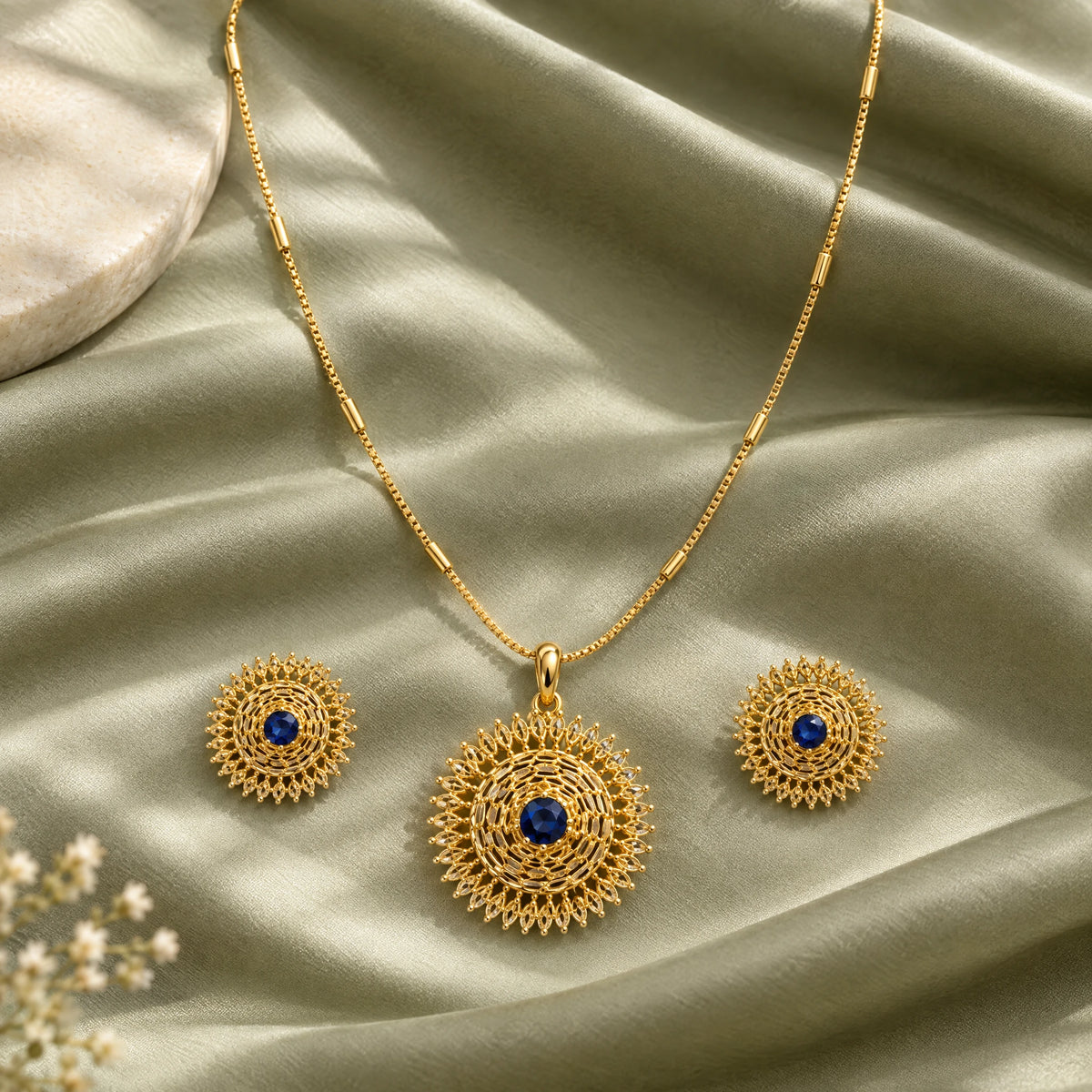 Sapphire Blue Filigree Pendant Necklace Set by Oraki Jewels, styled studio view