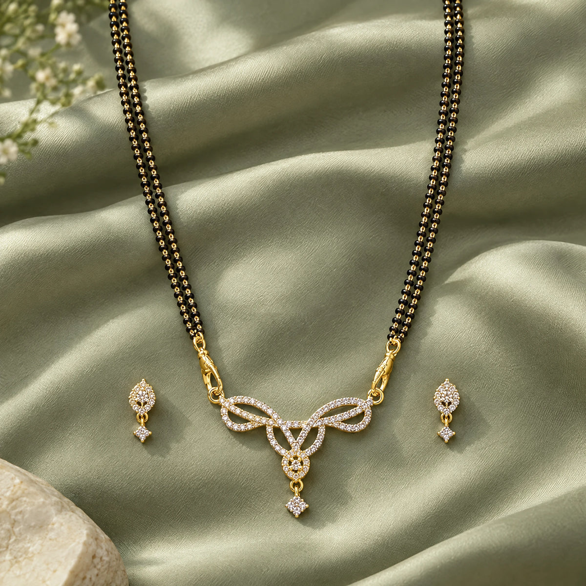 Aavya Bloom Black Bead Mangalsutra Set with Earrings by Oraki Jewels, styled studio view