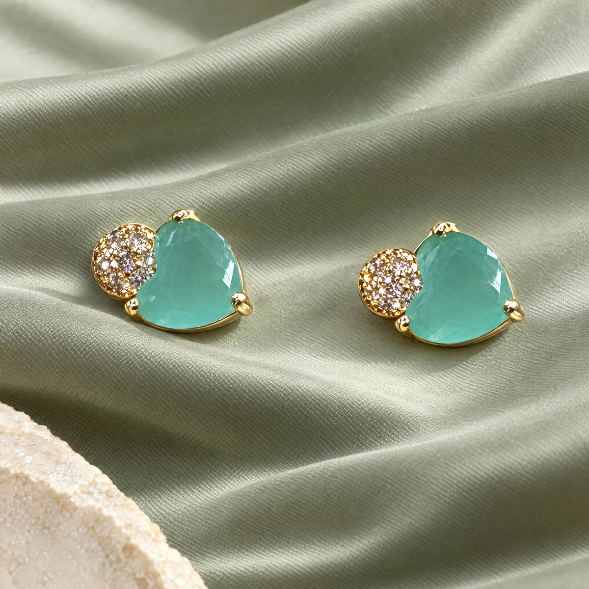 Aqua Heart Crystal Stud Earrings by Oraki Jewels, styled studio view
