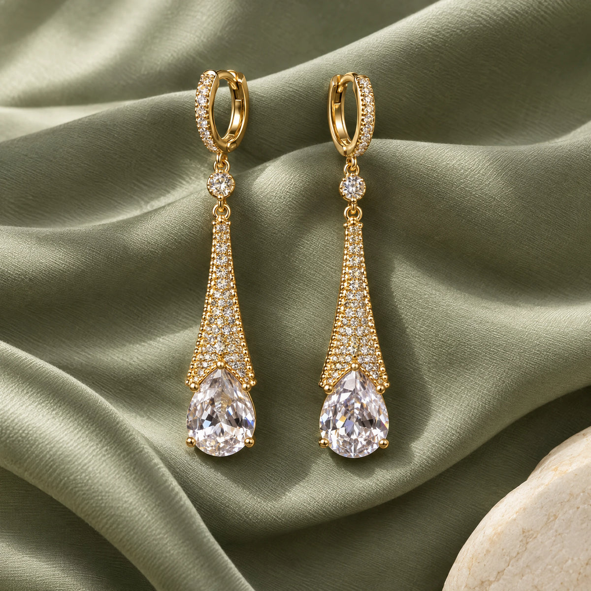 Aurelia Tapered Teardrop Crystal Hoop Earrings by Oraki Jewels, styled studio view
