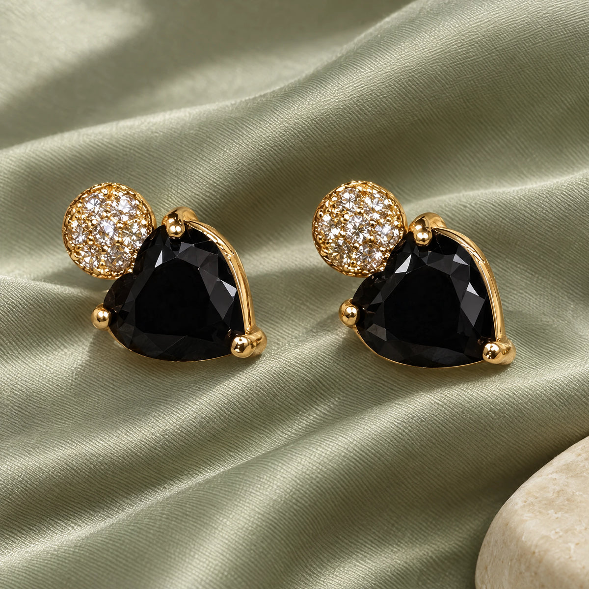Black Heart Crystal Stud Earrings by Oraki Jewels, styled studio view