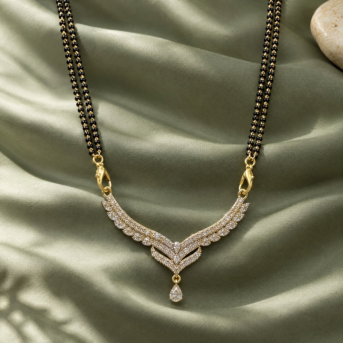 Celeste Wing Crystal Black Bead Mangalsutra by Oraki Jewels, styled studio view