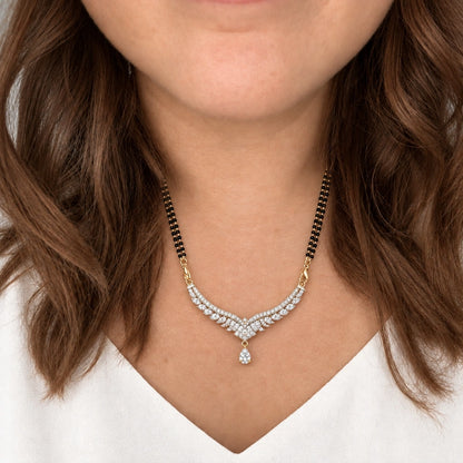 Celeste Wing Crystal Black Bead Mangalsutra by Oraki Jewels, shown worn in a natural studio crop