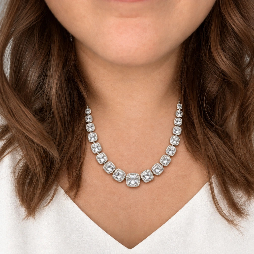 Clear Cushion Crystal Tennis Necklace Set by Oraki Jewels, shown worn in a natural studio crop