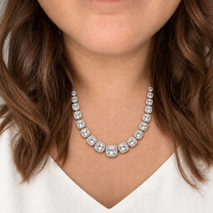 Clear Cushion Crystal Tennis Necklace Set by Oraki Jewels, shown worn in a natural studio crop