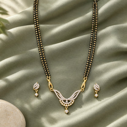 Elara Leaf Black Bead Mangalsutra Set with Earrings by Oraki Jewels, styled studio view