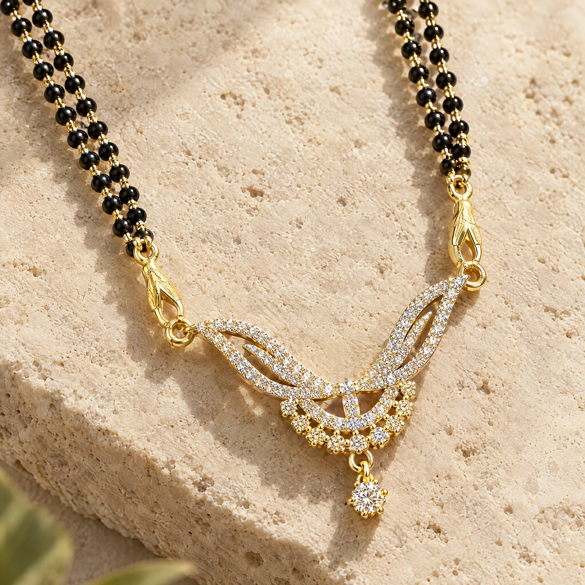 Elara Leaf Black Bead Mangalsutra Set with Earrings by Oraki Jewels, detail close-up