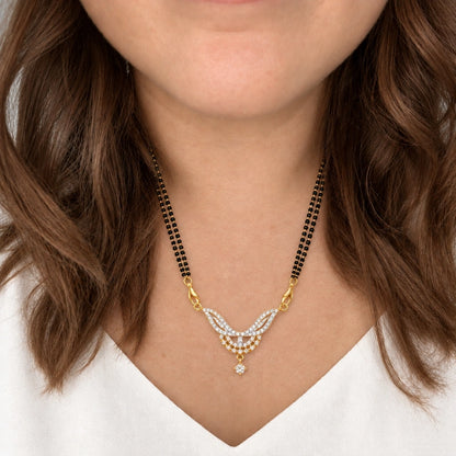 Elara Leaf Black Bead Mangalsutra Set with Earrings by Oraki Jewels, shown worn in a natural studio crop