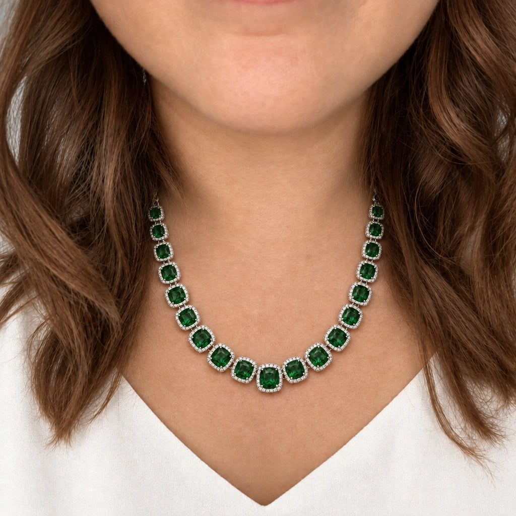 Emerald Green Cushion Tennis Necklace Set by Oraki Jewels, shown worn in a natural studio crop