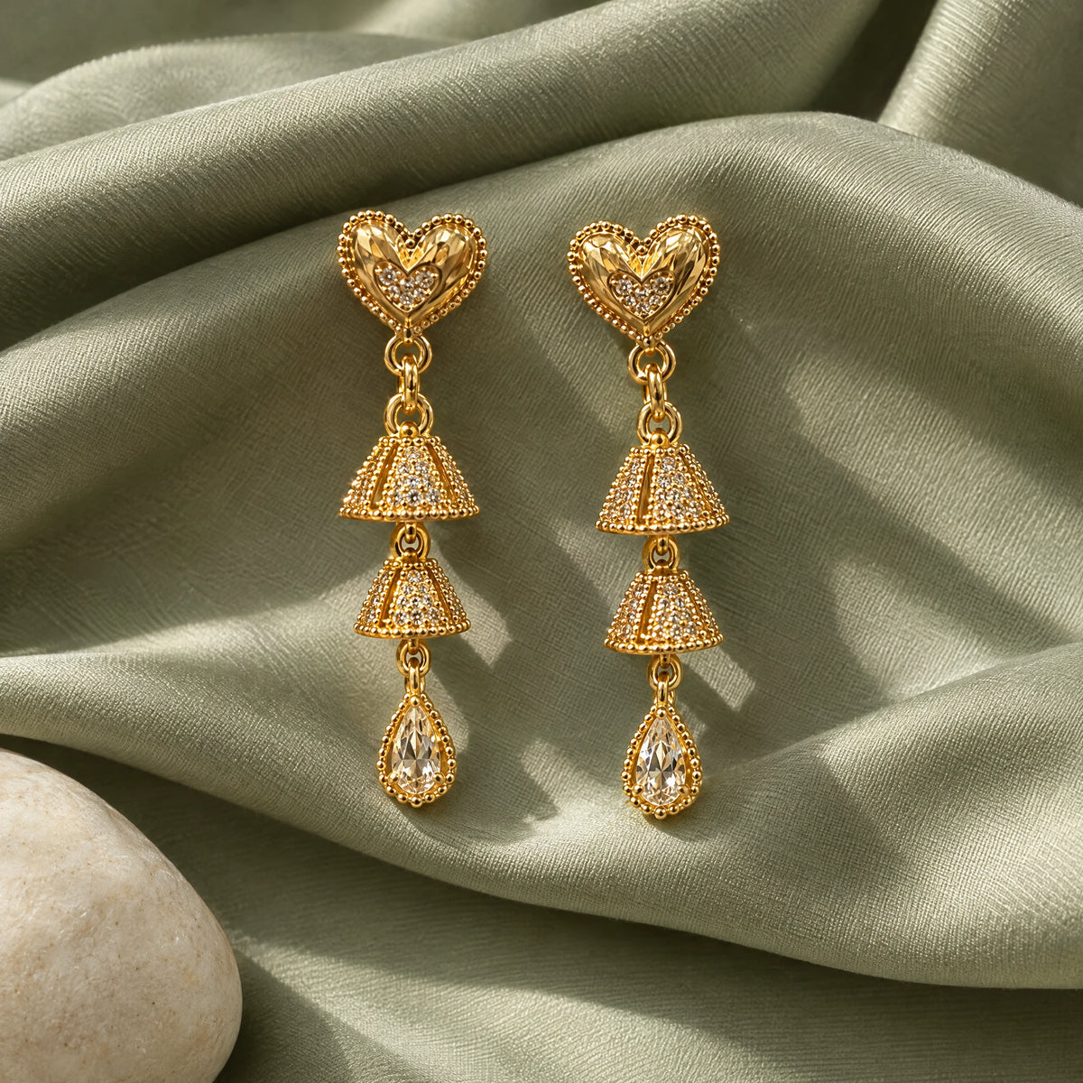Filigree Heart Teardrop Crystal Earrings by Oraki Jewels, styled studio view