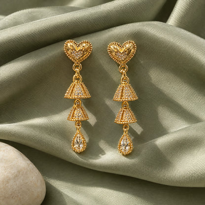 Filigree Heart Teardrop Crystal Earrings by Oraki Jewels, styled studio view