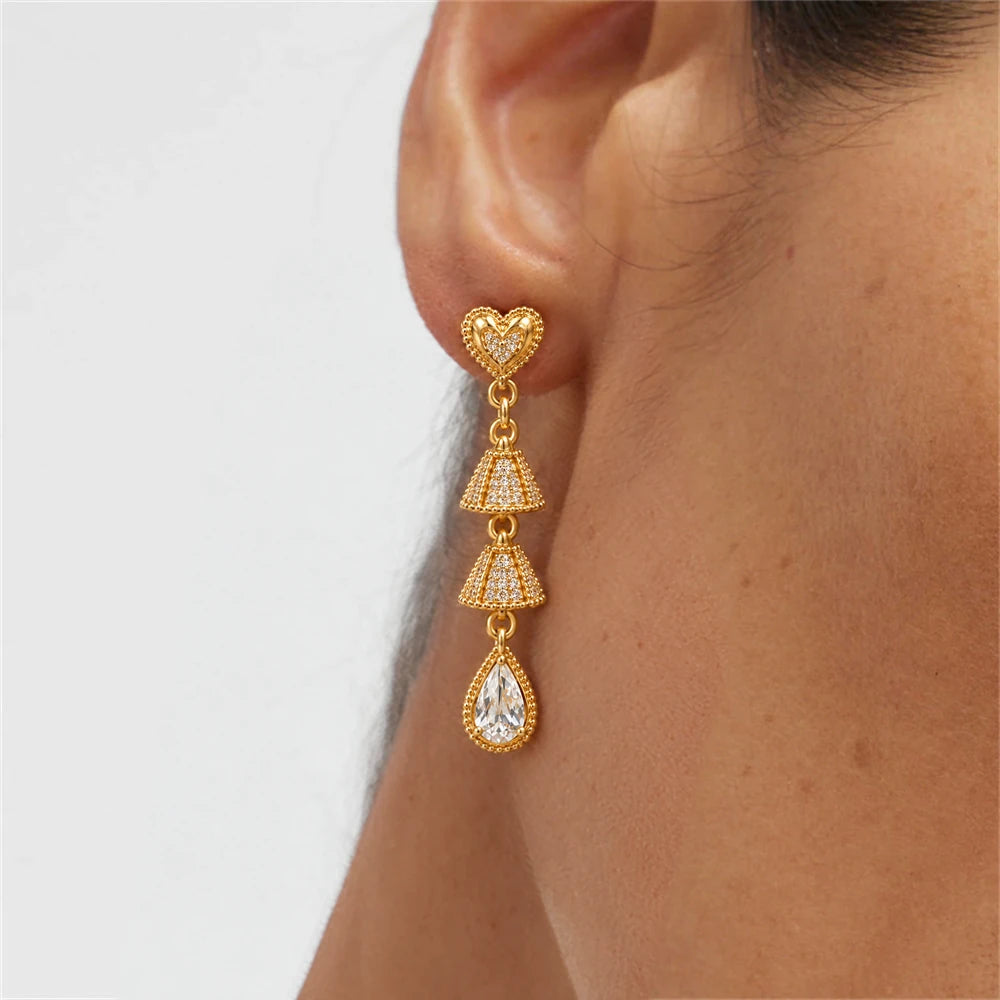 Filigree Heart Teardrop Crystal Earrings by Oraki Jewels, shown worn for styling