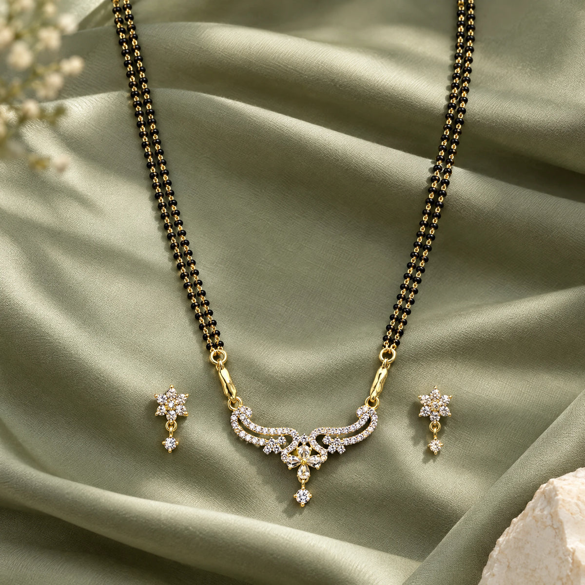Flora Grace Black Bead Mangalsutra Set with Earrings by Oraki Jewels, styled studio view