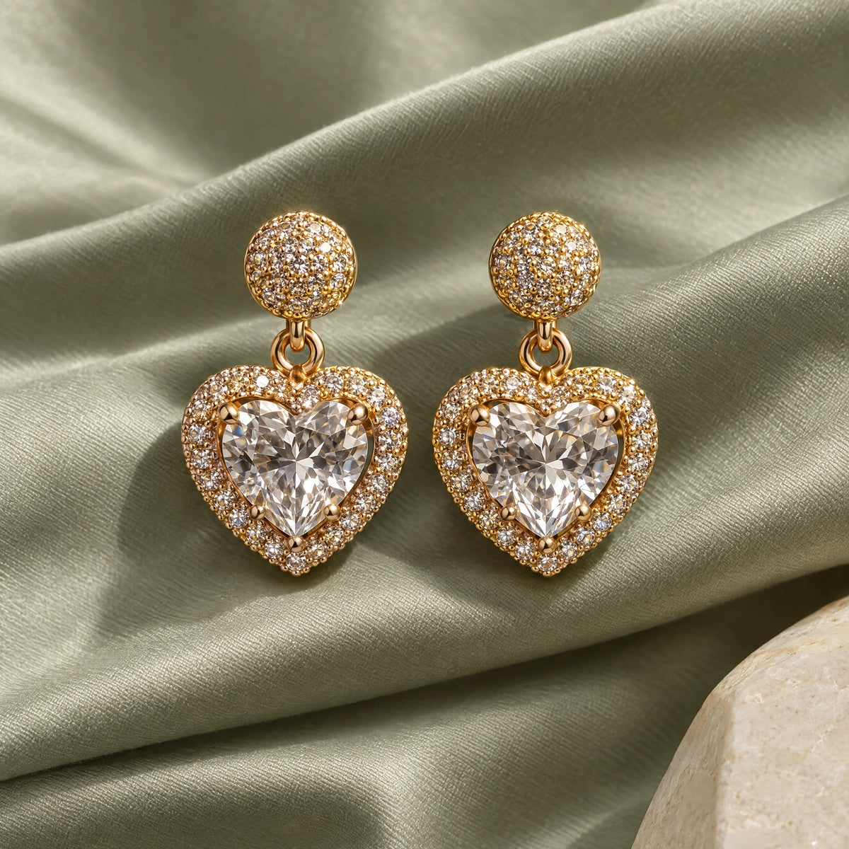 Heart Halo Crystal Drop Earrings by Oraki Jewels, styled studio view