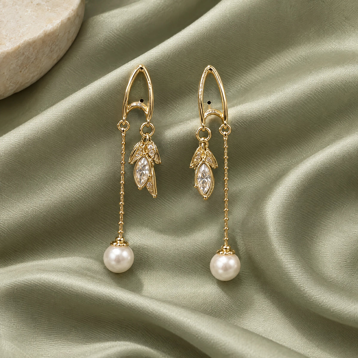 Pearl Leaf Chain Threader Earrings by Oraki Jewels, styled studio view