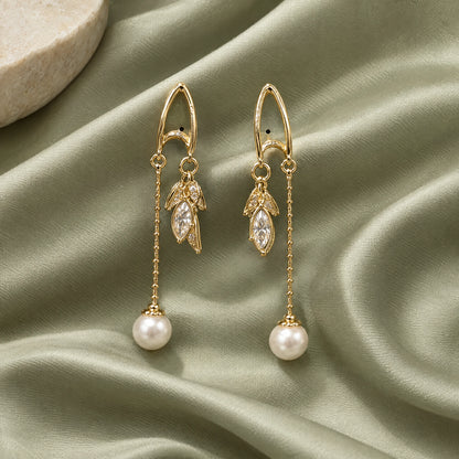 Pearl Leaf Chain Threader Earrings by Oraki Jewels, styled studio view