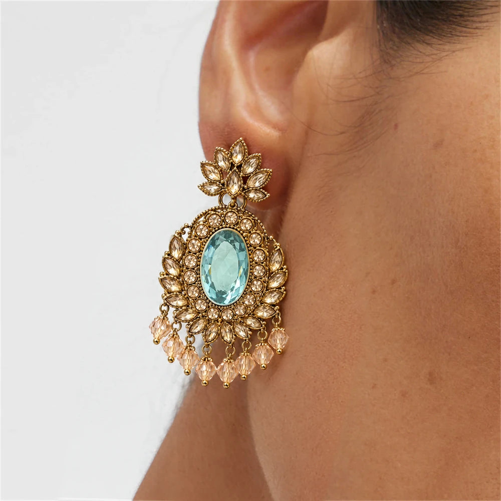 Rajwada Aqua Oval Crystal Chandbali Earrings by Oraki Jewels, shown worn for styling