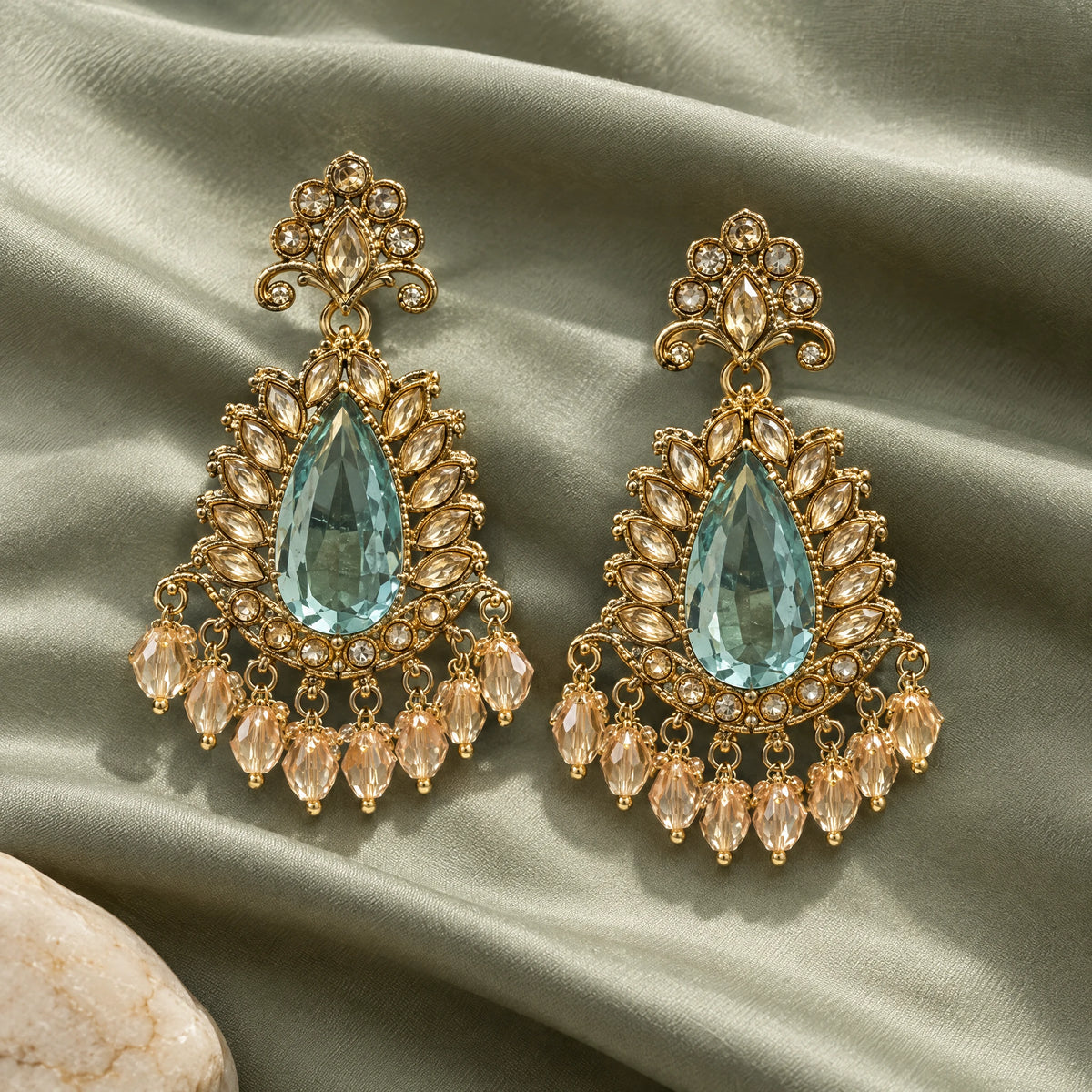 Rajwada Aqua Pear Crystal Chandbali Earrings by Oraki Jewels, styled studio view