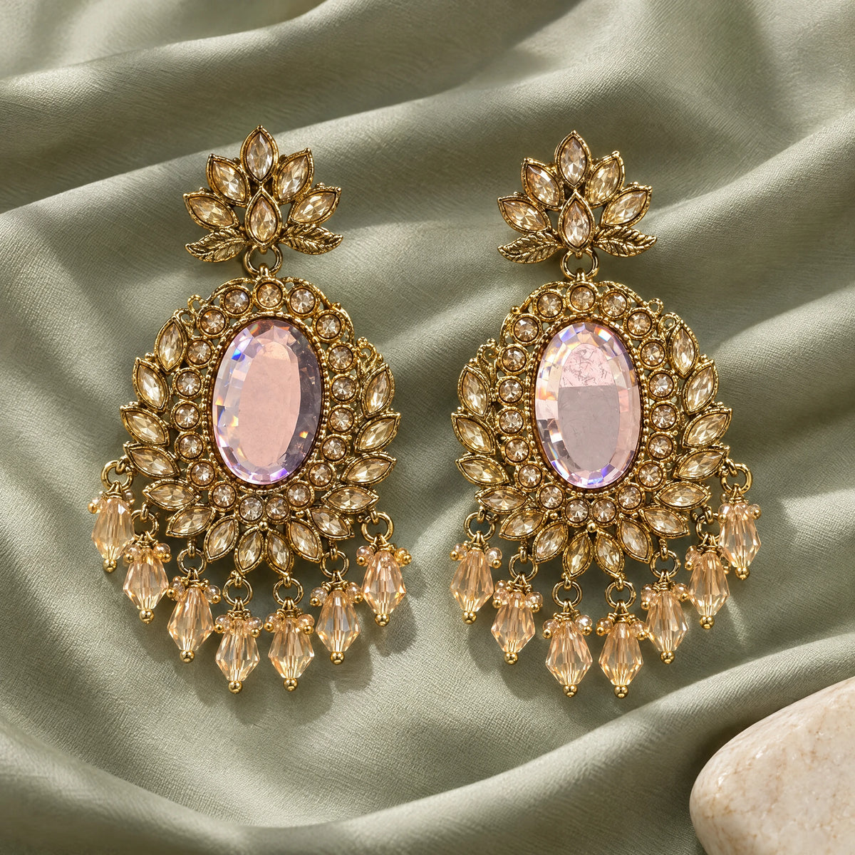 Rajwada Blush Oval Crystal Chandbali Earrings by Oraki Jewels, styled studio view