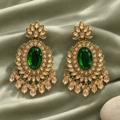 Rajwada Emerald Green Oval Crystal Chandbali Earrings by Oraki Jewels, styled studio view