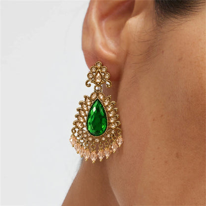Rajwada Emerald Green Pear Crystal Chandbali Earrings by Oraki Jewels, shown worn for styling