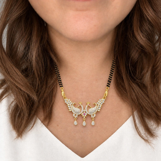 Royal Peacock Crystal Black Bead Mangalsutra by Oraki Jewels, shown worn in a natural studio crop