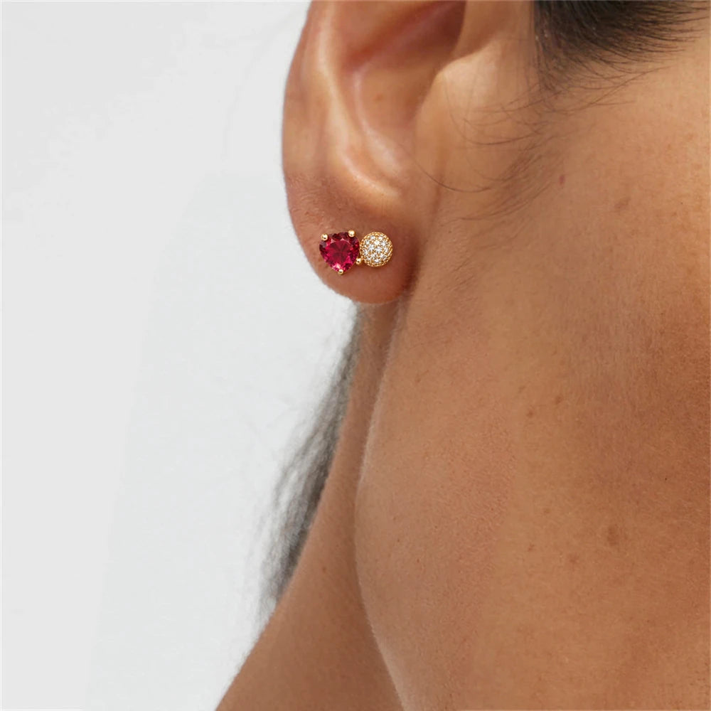 Ruby Pink Heart Crystal Stud Earrings by Oraki Jewels, shown worn for styling