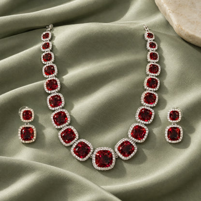 Ruby Red Cushion Tennis Necklace Set by Oraki Jewels, styled studio view