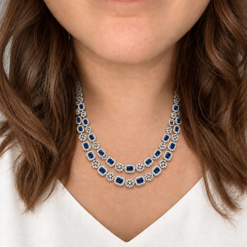 Sapphire Blue Cushion Crystal Necklace Set by Oraki Jewels, shown worn in a natural studio crop