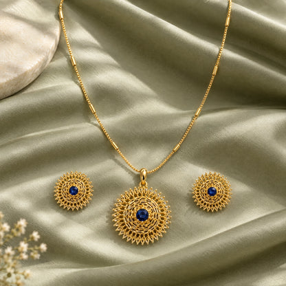 Sapphire Blue Filigree Pendant Necklace Set by Oraki Jewels, styled studio view
